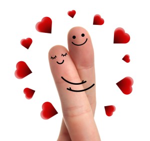 Cute couple in love with smiley, red heart and hugging.