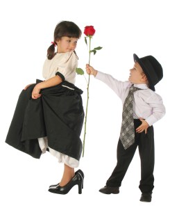 Little boy and girl with red rose